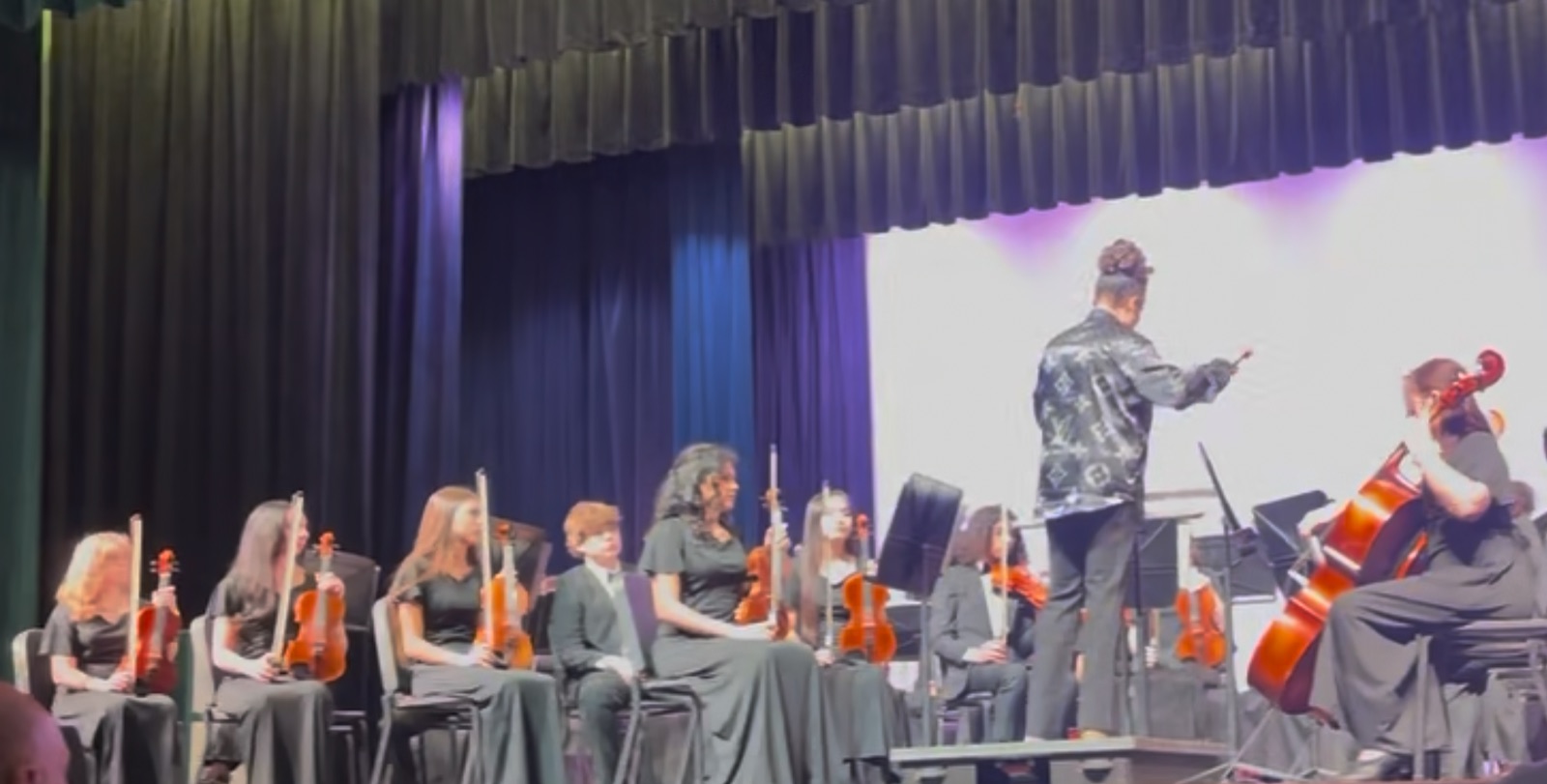 Philharmonic Orchestra seated on stage at Pre-MPA Concert